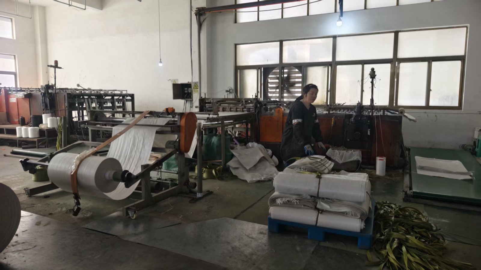 Bag cutting and sewing bay with conversion machinery